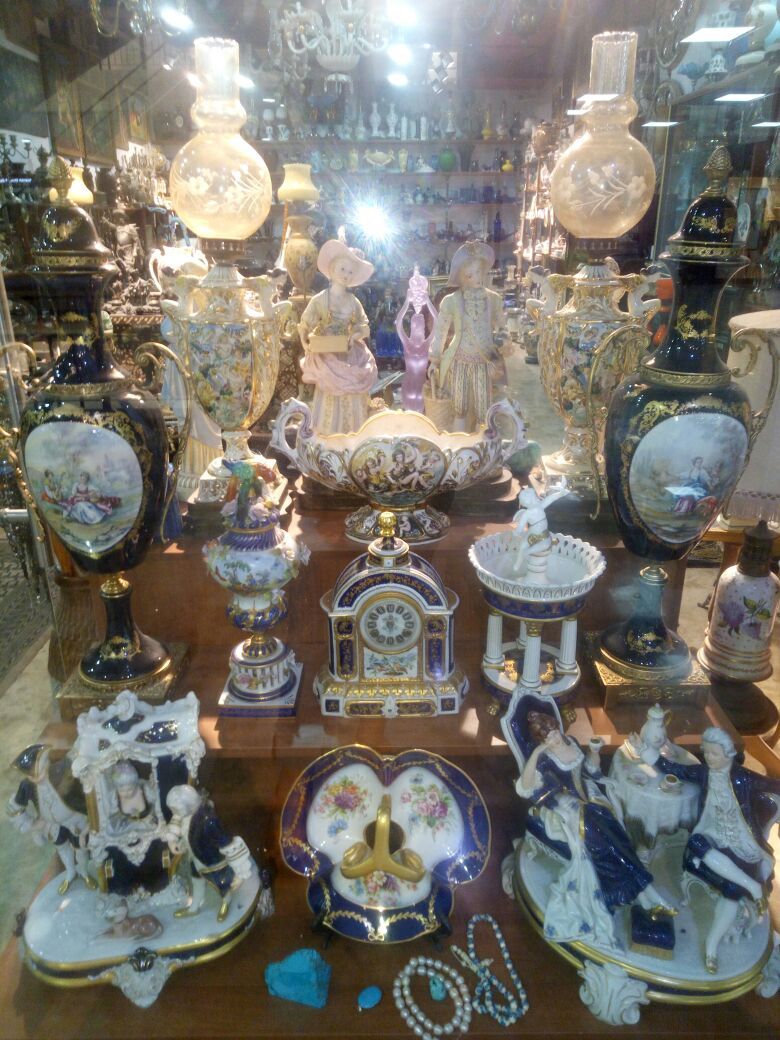 antiques shop, hand made jewelry, silver and bronze statues, old paintings, old chandeliers, all kinds of crystals