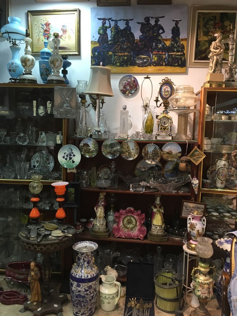 antiques shop, hand made jewelry, silver and bronze statues, old paintings, old chandeliers, all kinds of crystals