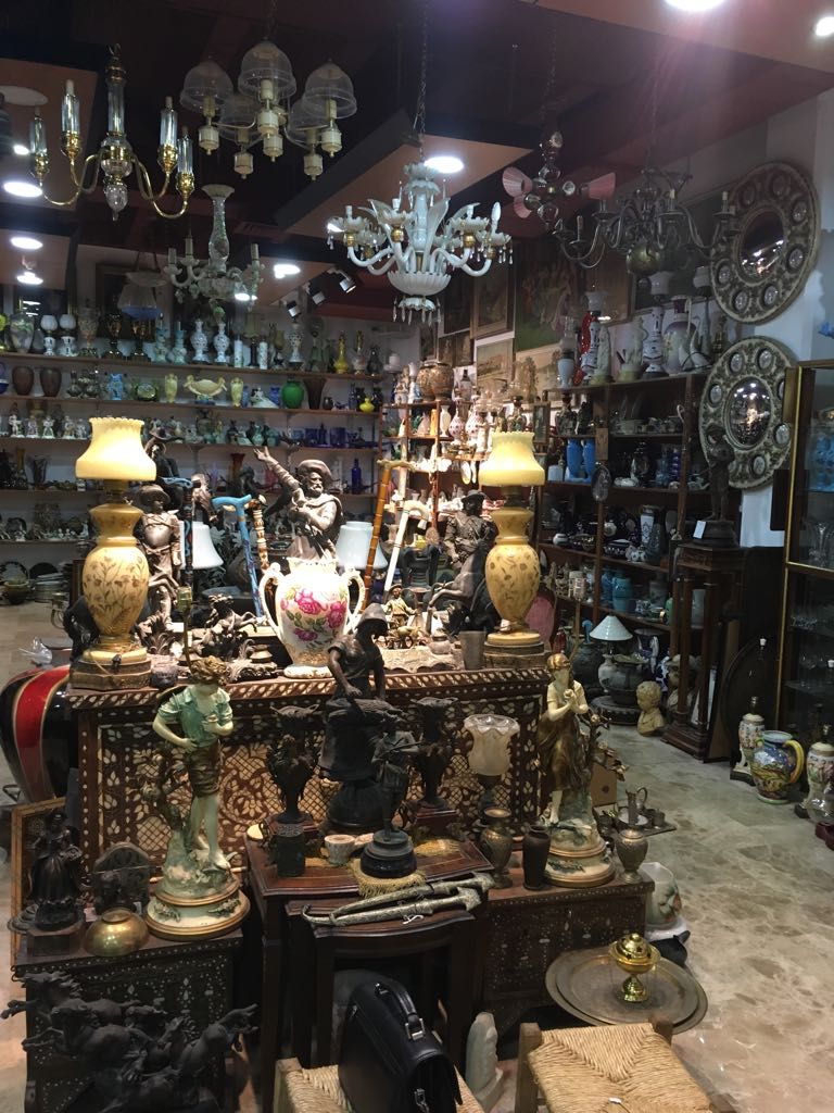 antiques shop, hand made jewelry, silver and bronze statues, old paintings, old chandeliers, all kinds of crystals